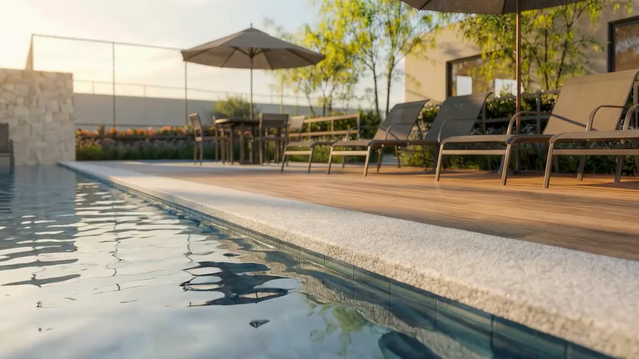 Piscina e deck das áreas comuns ao entardecer, com espreguiçadeiras, ombrelones e mesa (perspectiva ilustrada)